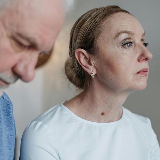 Couple looking stressed at thought of relocating